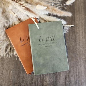 May include: A set of three ceramic mugs with a speckled, matte finish. The mugs are in shades of cream, light brown, and dark brown. Each mug has a simple, minimalist design, perfect for coffee or tea.
