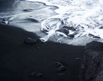 White sea foam on the black sand of Stromboli lava. Sicily. Photo Print photo in color. Eolie Islands Stromboli Messina