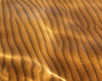 the beach. Photo print. La sable. Sicily in the south. traces of sand below the surface of the sea