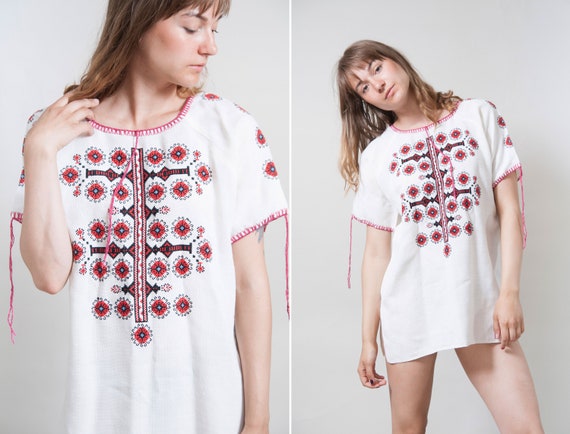 Sheer white folk-style blouse with embroidery