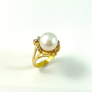 14 K Pearl and Diamond ring, large pearl with diamonds set in yellow and white gold, size 7