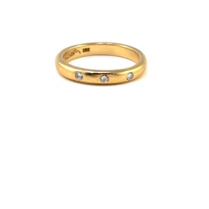 18K yellow gold and diamond band set with 3 round brilliant cut natural diamonds, size 6 1/2