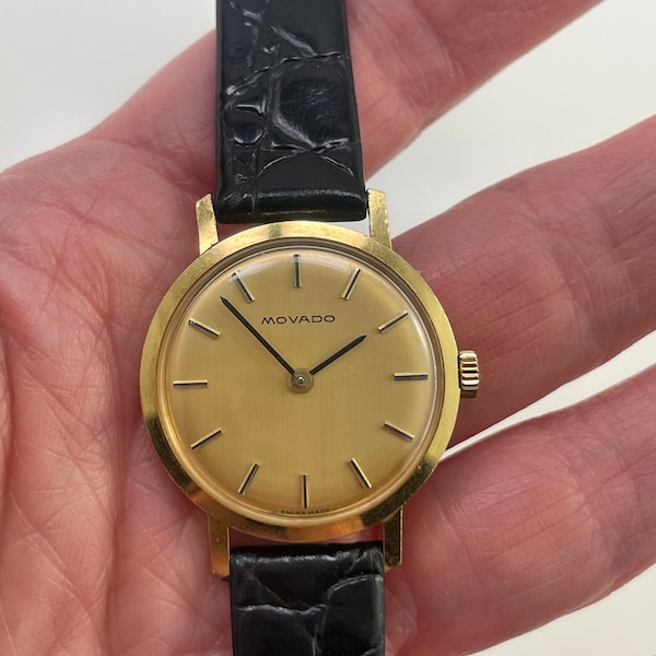 18K Gold MOVADO Wrist Watch, black leather strap, 25 mm case