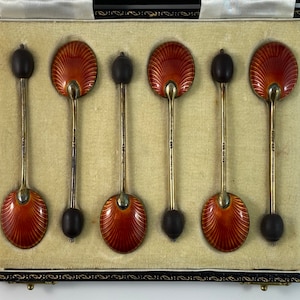 Sterling Birmingham English sterling enamel red/orange guilloche coffee spoons, in original box. Set of Six spoons.