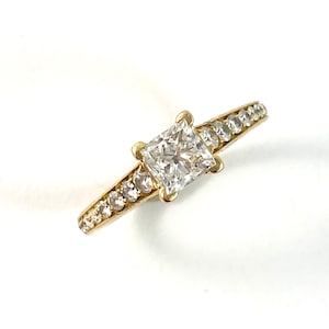 14K Diamond ring,  one princess cut diamond weighing .80 ct VS2 F,  18 round brilliant cut diamonds set on the shoulders,engagement ring