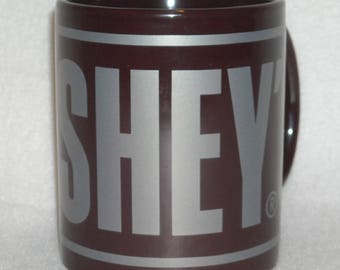 Collectible Hershey’s S’Mores Mug. Promo Novelty Cup for the Cocoa or Hot Chocolate Lover. Dark Brown Background w Lg Silver Letters. Qggc