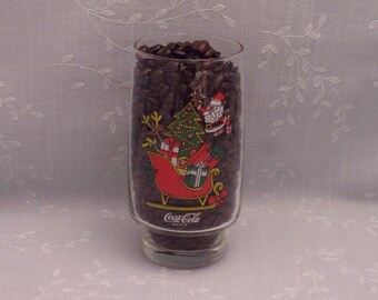 1980s Christmas Tumbler. Vintage Coca Cola & Five and Dime McCrory Stores Promo Drinking Glass w Santa Claus, Sled, and Trimmed Tree. skkan