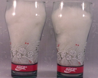 2 Christmas Vintage Tumblers. Collectible Tinted Libbey Coke Glasses w Enjoy Coca Cola Slogan, White Pine Cones, and Red & Green Bands. Qi8a