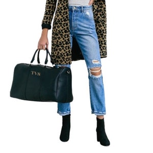a woman in a leopard print coat holding a black bag, Century, all caps  font option