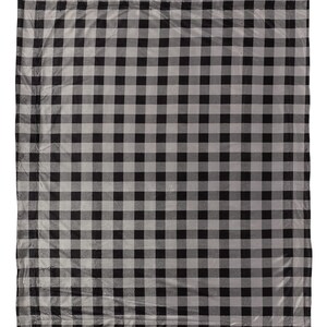 a black and white checkered blanket on a white background