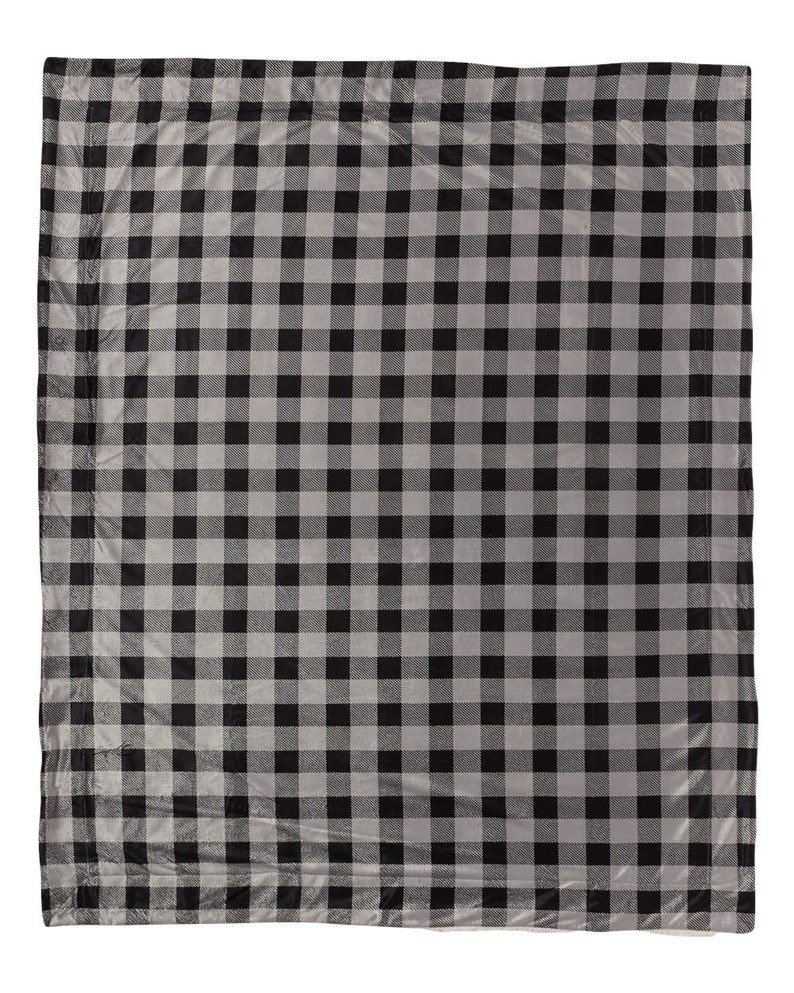 a black and white checkered blanket on a white background
