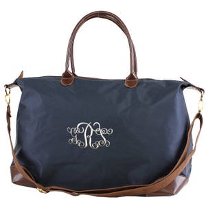 a blue bag with a monogrammed monogram