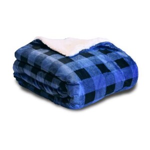 a blue and black blanket with a white blanket on top of it