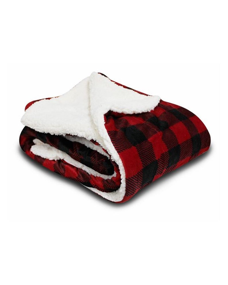 a red and black blanket with a white blanket