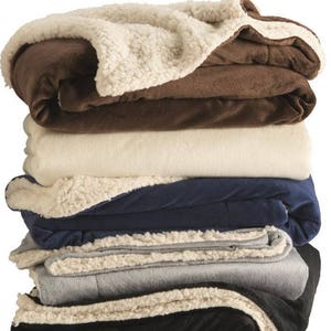 a pile of blankets stacked on top of each other