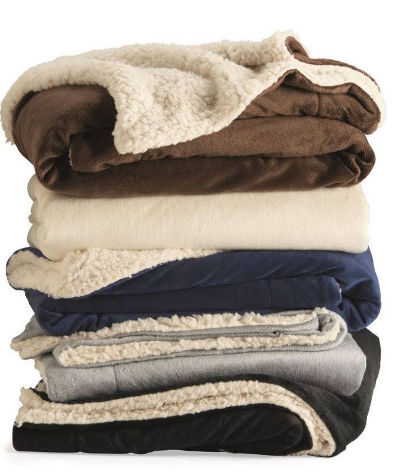 a pile of blankets stacked on top of each other