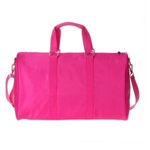 a pink bag with a handle on a white background