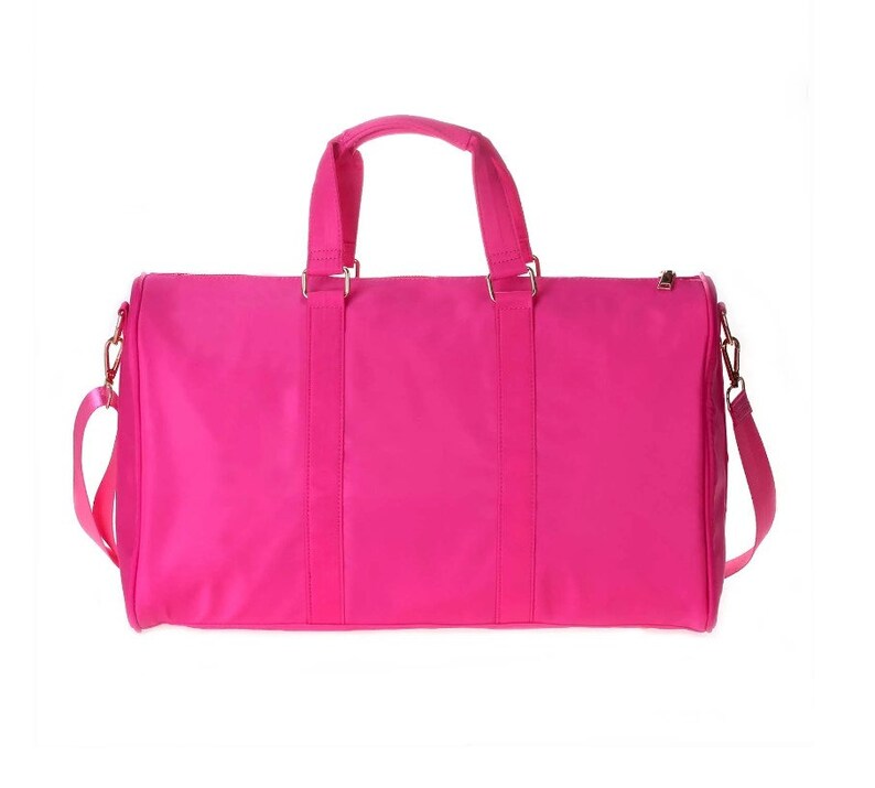 a pink bag with a handle on a white background