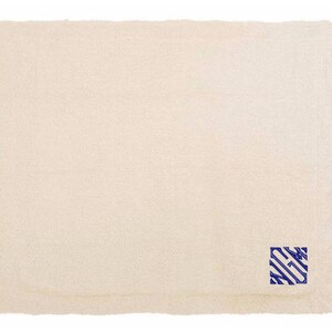 a white towel with a blue stripe on it