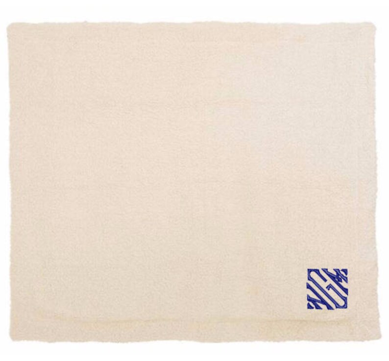 a white towel with a blue stripe on it