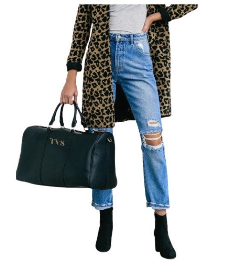 a woman in a leopard print coat holding a black bag, Century, all caps  font option