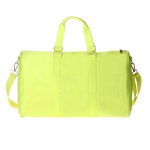 a neon yellow duffel bag on a white background