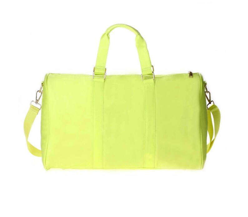 a neon yellow duffel bag on a white background