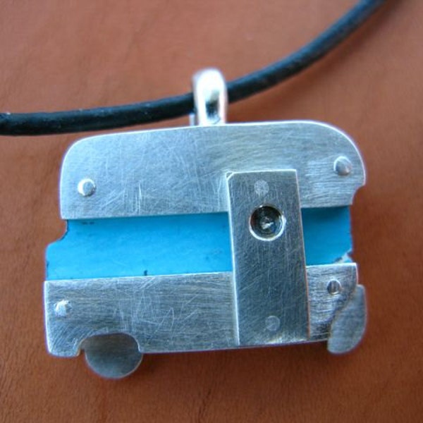 Nickel Silver and sterling silver pendant on cord