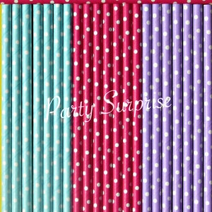 May include: A set of colorful paper straws with white polka dots. The straws are arranged in rows of blue, pink, and purple. The text "Party Surprise" is printed on the straws.