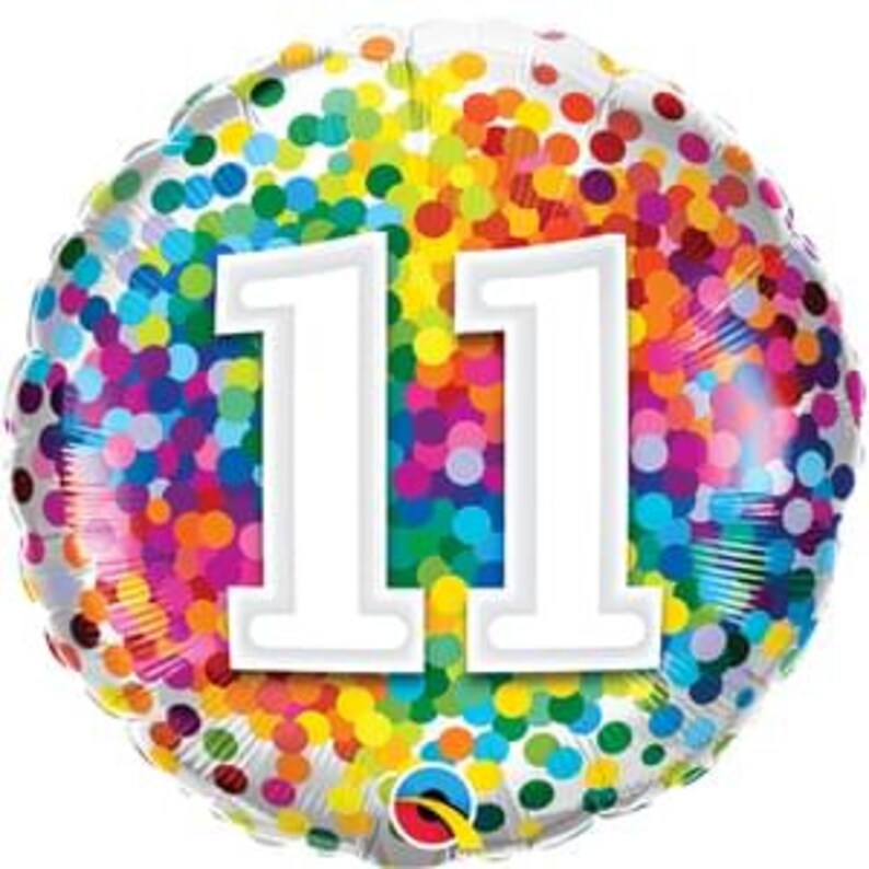 May include: A silver foil balloon with a white number 11 on a background of colorful confetti dots.