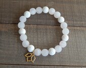 Matte rose quartz and white lava rock bracelet, lotus charm, yoga bracelet, essential oil, chakra jewelry, boho chic, zen jewelry
