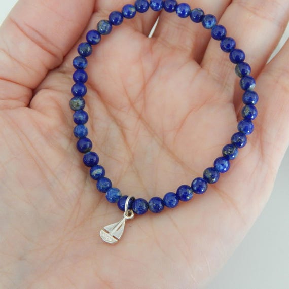 Dainty lapis stretch bracelet with sterling silver sailboat charm, boho chic, delicate stacking bracelet