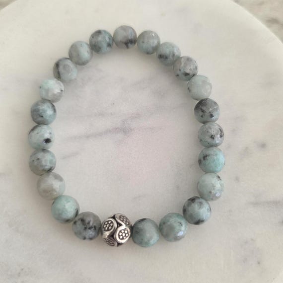 Kiwi jasper stretch bracelet with sterling silver hill tribe bead