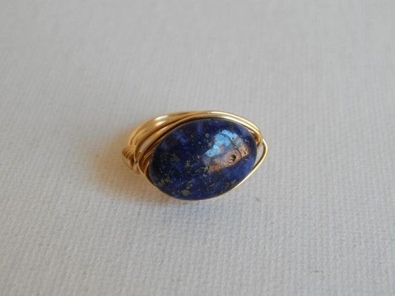 Gold wire wrapped blue lapis ring