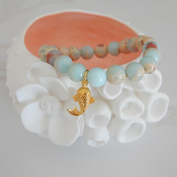 Aqua terra jasper stretch bracelet with gold vermeil fish charm, stacking bracelet, blue and red, boho chic, wildlife
