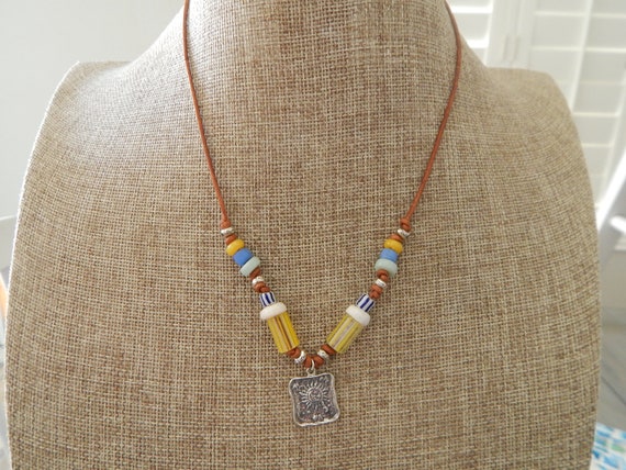 Leather necklace with sterling silver sun charm and vintage beads, beachy boho style, beach chic necklace