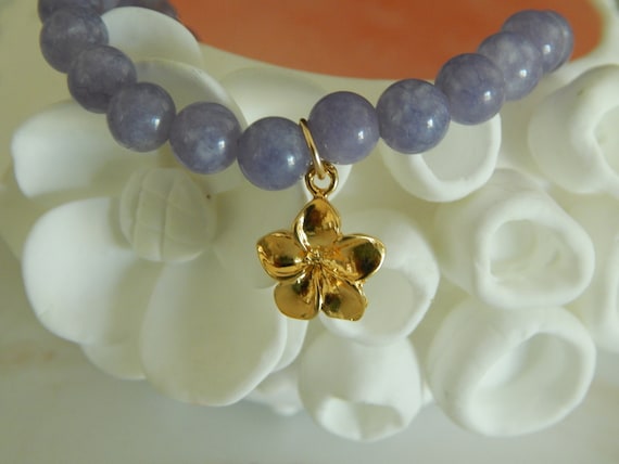 Purple tanzite bracelet with gold vermeil plumeria charm, stacking bracelet, lilac gemstone, gift for her