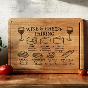 May include: Wooden rectangular chopping board with engraved text and illustrations. The board features wine glasses, cheese, and food pairings. Text includes "Wine & Cheese Pairing" and food pairing suggestions.