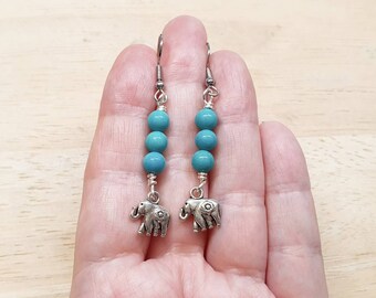 Turquoise Elephant earrings. Crystal Reiki jewelry uk. December birthstone. Silver plated charm earrings