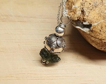 Small Raw Moldavite pendant necklace. Crystal Reiki jewelry uk. Bali silver bead jewellery.