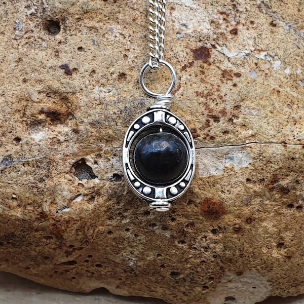 Tiny Arfvedsonite pendant. Reiki jewelry uk. Oval Silver plated Wire wrapped pendant. 8mm stone
