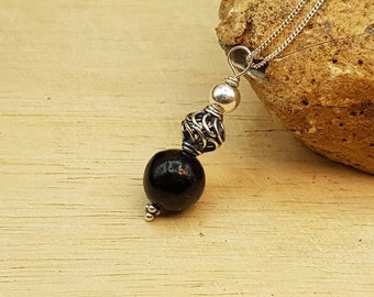 Small Black Jet pendant. Reiki jewelry uk. Minimalist Bali silver Wire wrapped pendant.