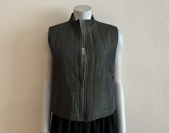 Green sleeveless shop jacket