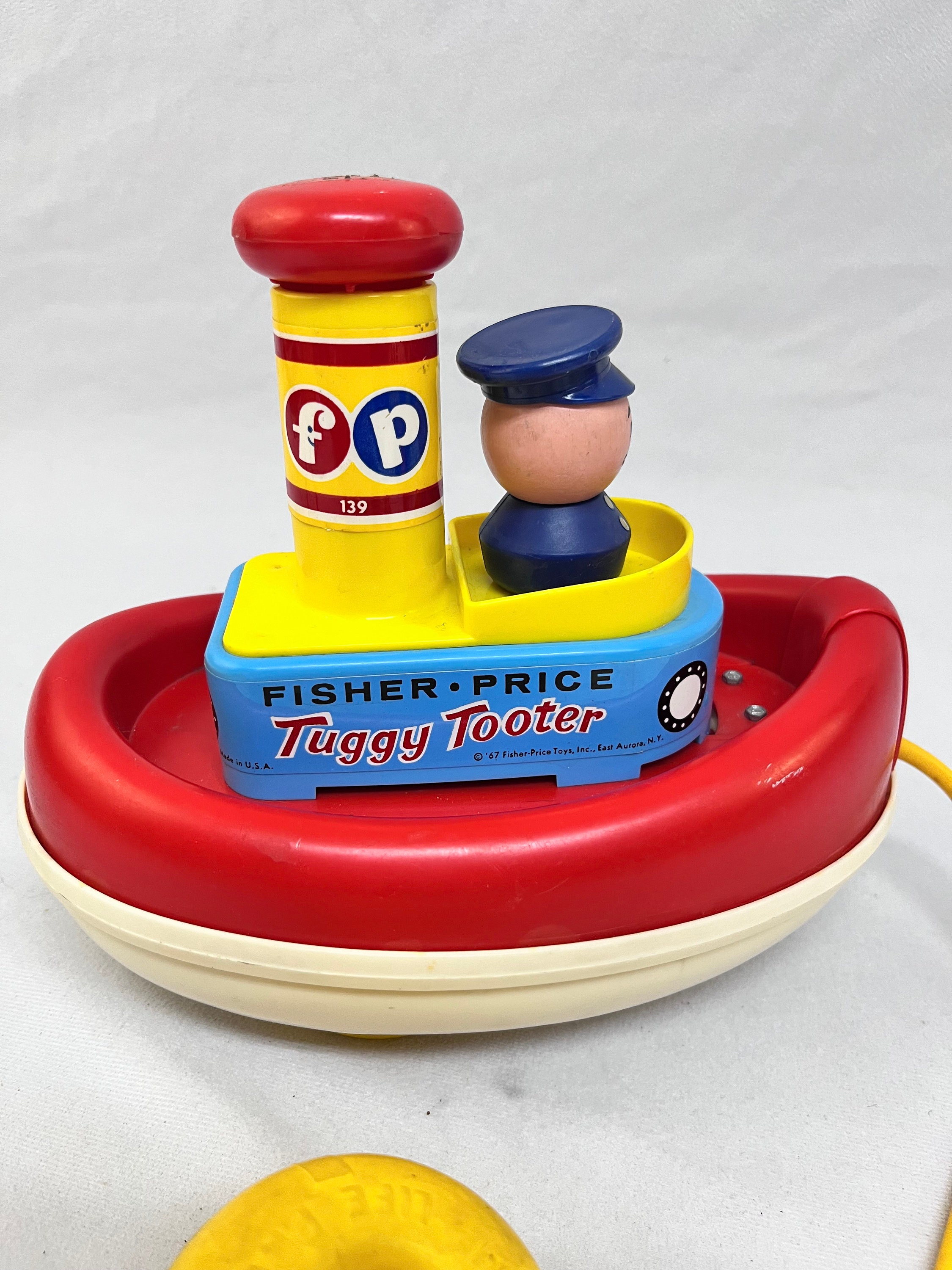 フィッシャープライス　ヴィンテージ　TUGGY TOOTER トイストーリー Fisher Price Vintage Tuggy Tooter Pull Toy 1967 - Etsy
