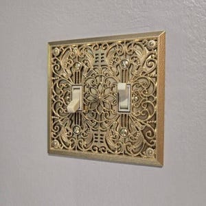 May include: A set of three ceramic mugs with a speckled, matte finish. Each mug features a different color: light blue, cream, and gray. The mugs have a simple, modern design and a comfortable handle.