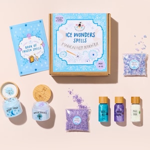 May include: An 'Ice Wonders Spells' kit with a 'Book of Frozen Spells' and various potion ingredients. Includes jars labeled 'Night Frost' and 'Winter Serenity', plus bottles of 'Arctic Mist', 'Twilight Essence', and 'Magic Snow'. The kit is designed for ages 4-10.
