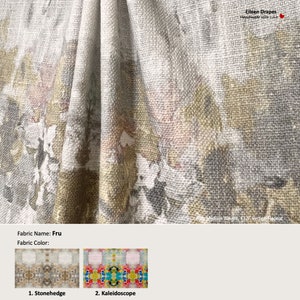 May include: A close-up of a fabric sample with a floral pattern in shades of gray, white, and gold. The fabric is a medium weight and has a vertical repeat. The fabric name is "Fru" and the fabric colors are "Stonehedge" and "Kaleidoscope".