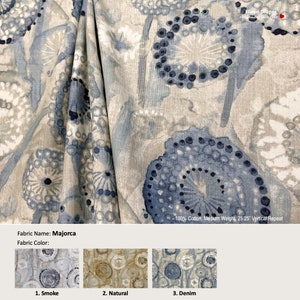 May include: A fabric swatch with a floral pattern in shades of blue and beige. The fabric is called "Majorca" and is available in three colors: Smoke, Natural, and Denim. 100% Cotton, Medium Weight, 25.25" Vertical Repeat.