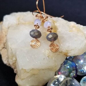 Copper spiral metalwork lavender earrings