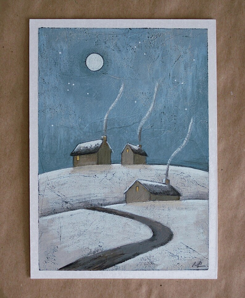 May include: A painting on a white rectangular background depicting a snowy landscape at night with three small houses. Each house has a glowing yellow window and a chimney emitting white smoke. A full moon shines in the blue sky above the hills.